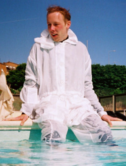 windbreaker anorak as modest swimwear in pool