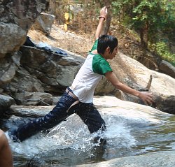 jeans wet white T-shirt in river