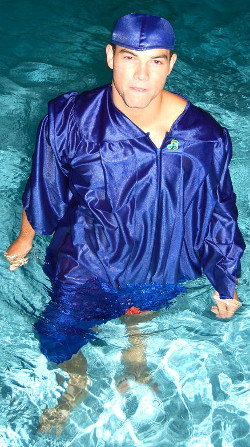 Swimming in baptism robe or graduation gown